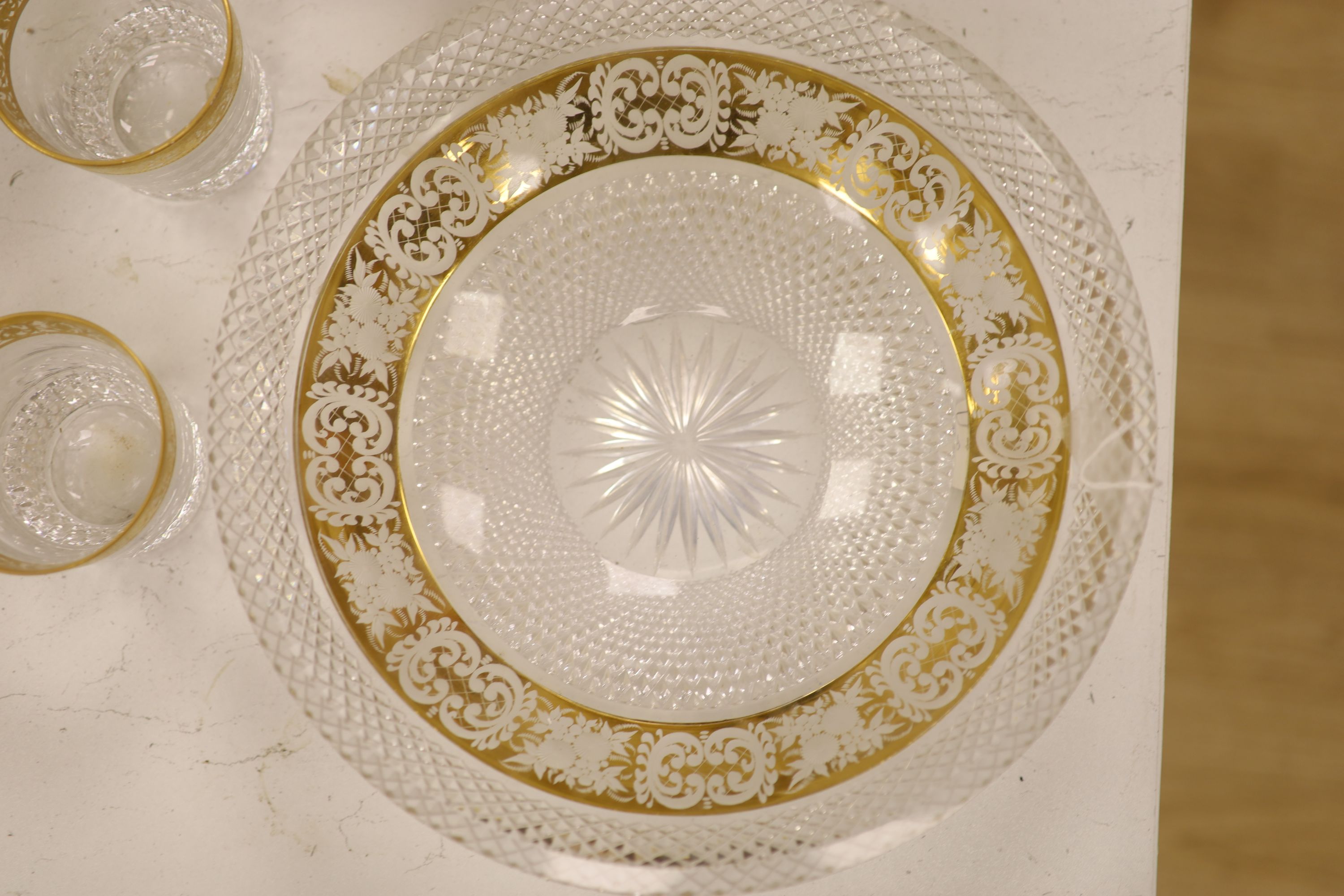 A Moser style tall tapered cut glass vase heightened in gilt, a similar circular bowl, a pedestal bowl and two St Louis tumblers